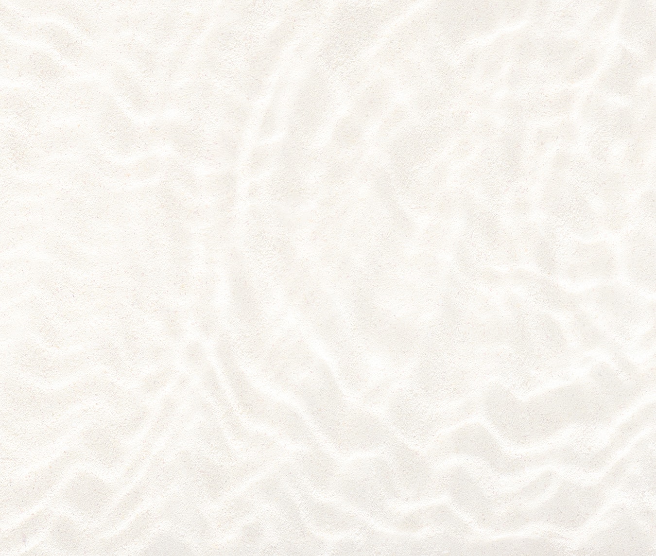 White sandy beach texture with gentle waves.