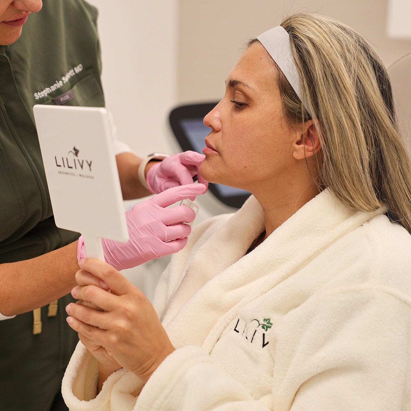 Client receiving cosmetic treatment in clinic setting.