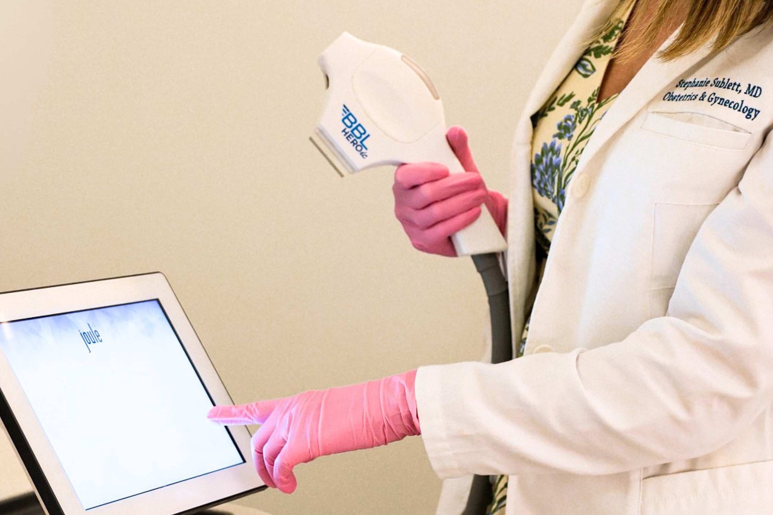 Medical professional using a device on tablet.