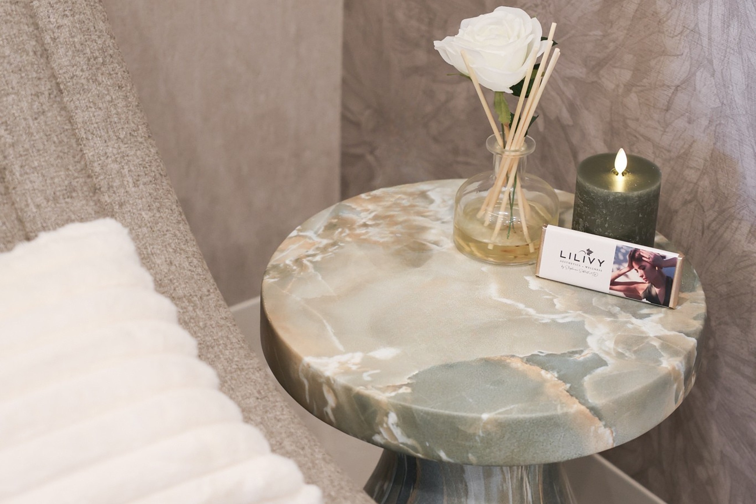 Elegant tabletop with decor and branding.