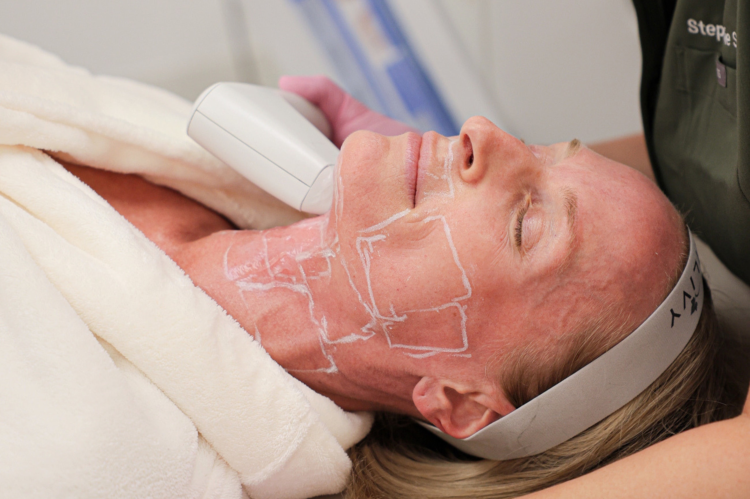 Facial treatment procedure in clinic setting.